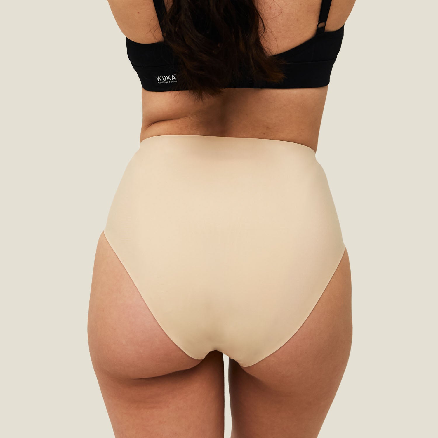 Back view of WUKA Teen Stretch Midi Brief period pants in Light Nude, designed for teens with heavy flow periods.