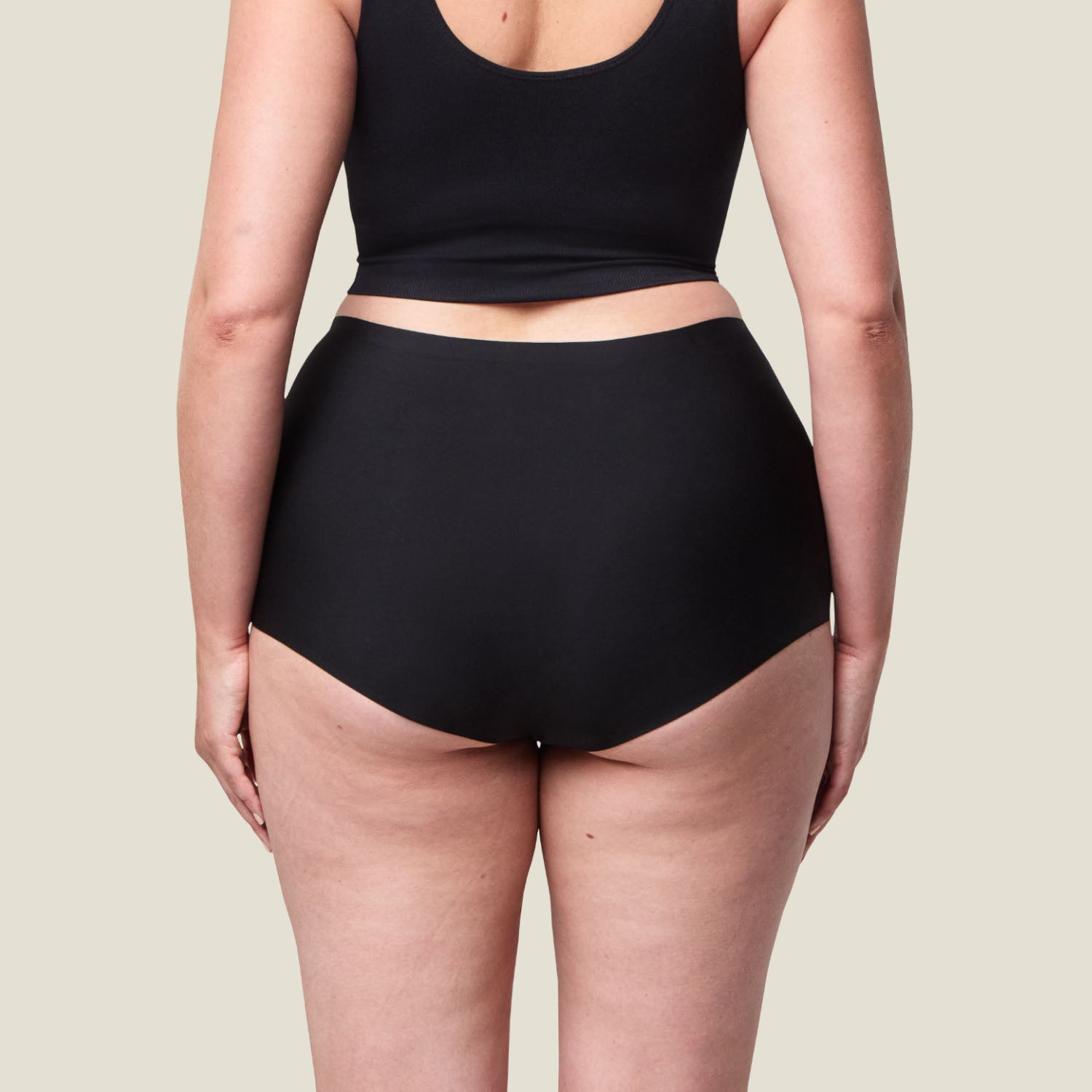 Back view of WUKA Stretch™ Boxer Period Pants in black, showcasing full-coverage design and seam detailing for leak-proof confidence.