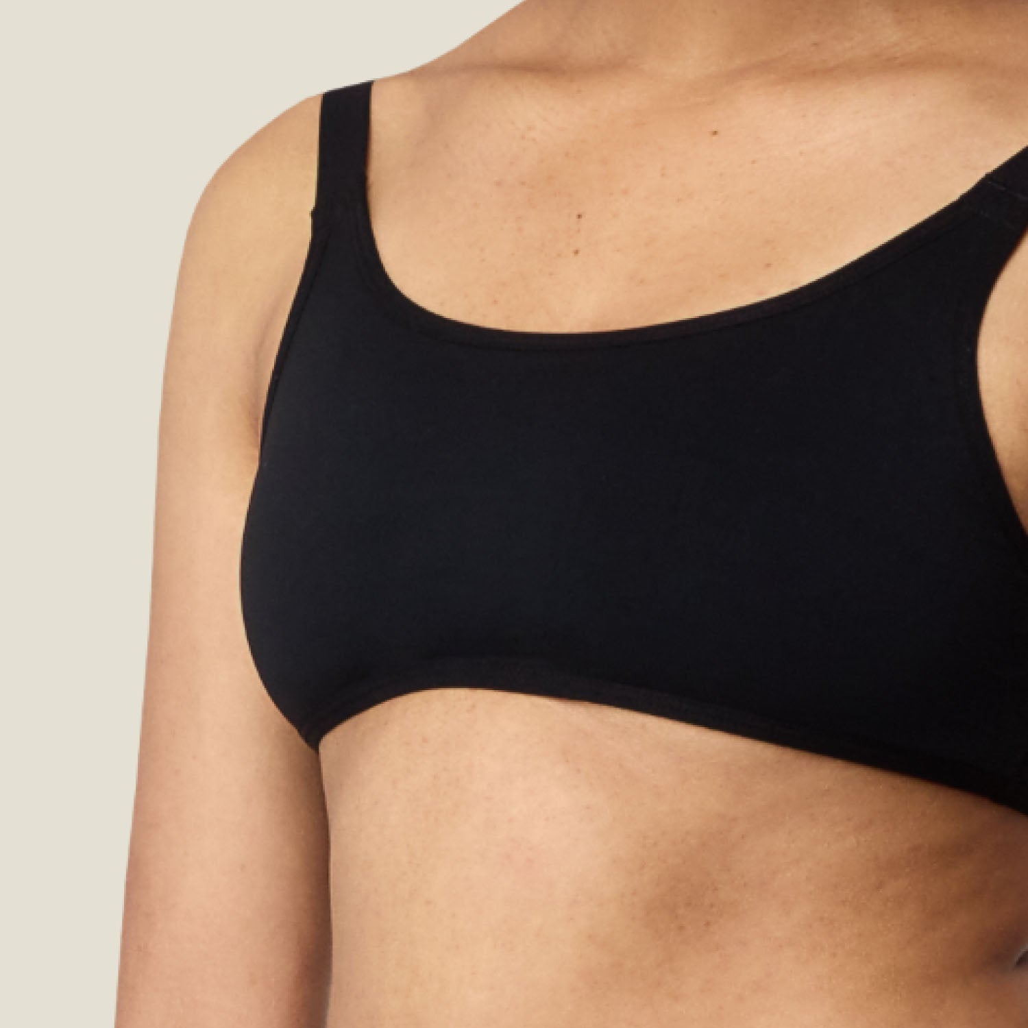 Front detail of WUKA Teen Adjustable Bikini Top — clean neckline with built-in bust support.