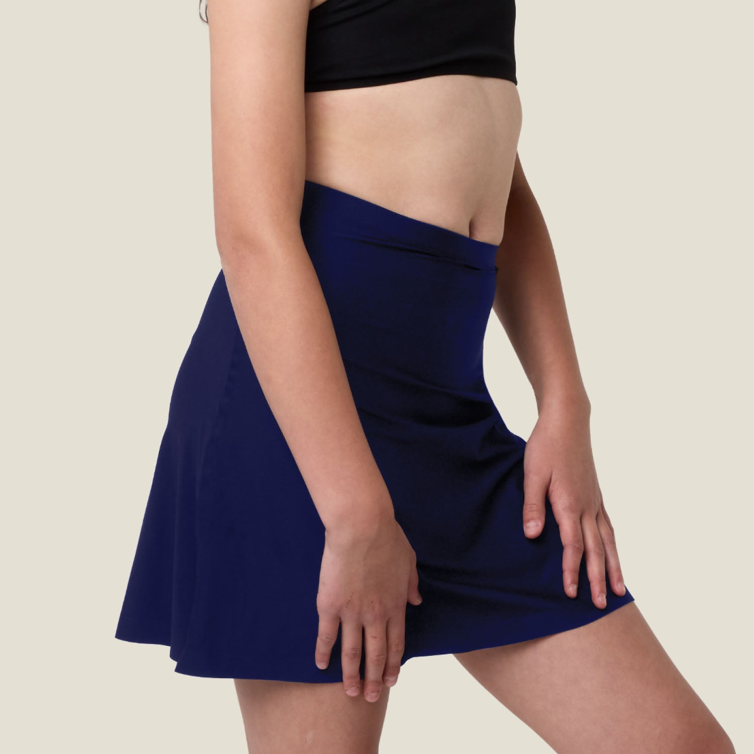 Side angle of navy WUKA Period Skort — seamless design that moves with your body.
