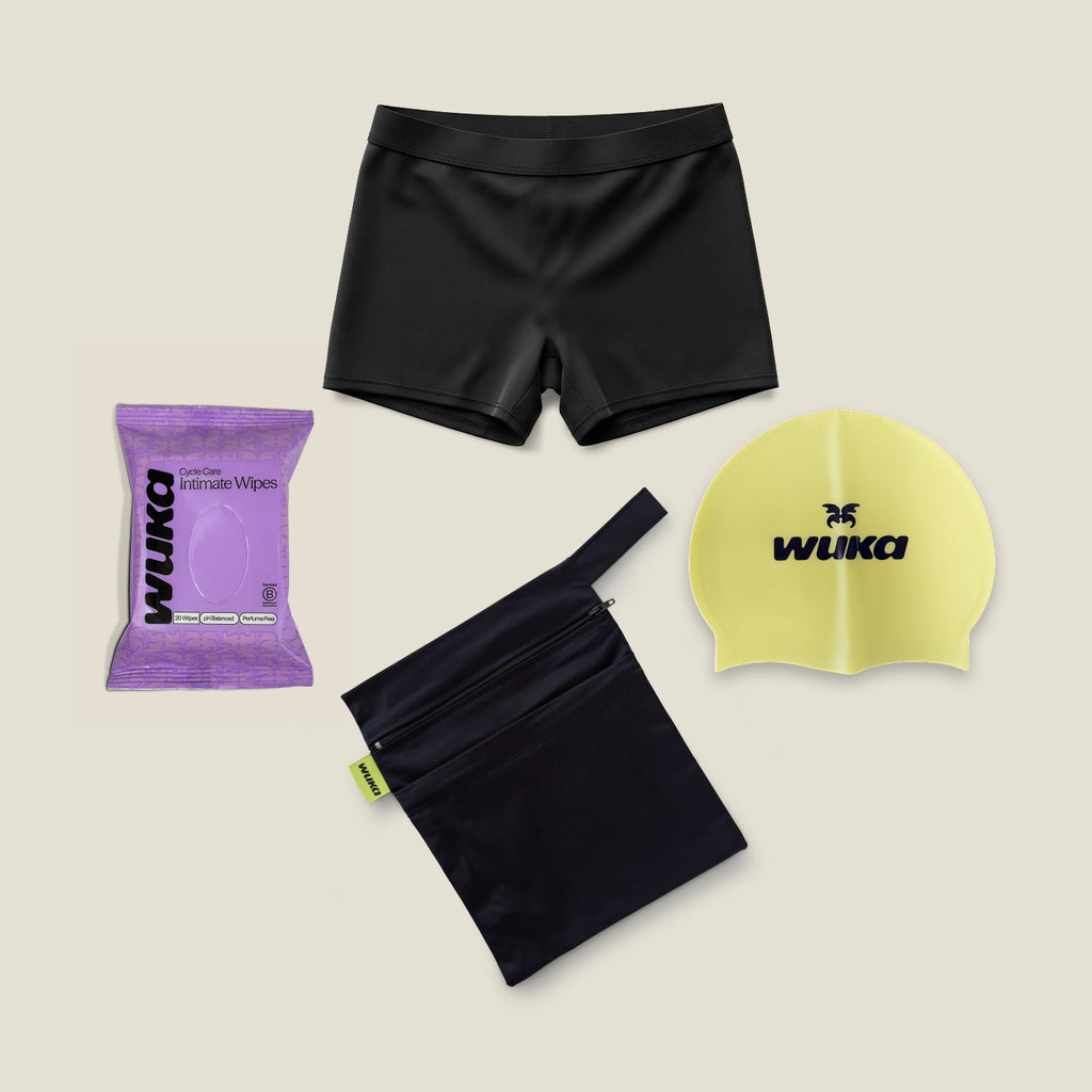 Black teen period-proof swim shorts starter kit with waterproof wet bag, swim cap and intimate wipes by WUKA