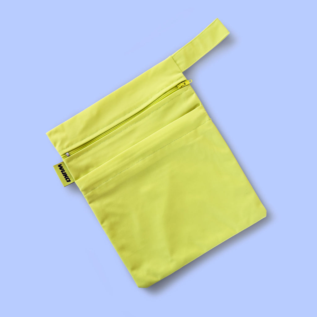 Waterproof changing bag included in the WUKA Lunafly Racerback period swim kit