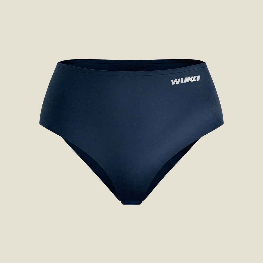 Flat-lay image of WUKA Stretch™ Midi Brief in Navy for heavy flow, showcasing minimalist design and WUKA logo